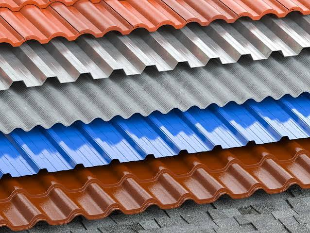 Several metal roofing panel profiles in different colors and shapes
