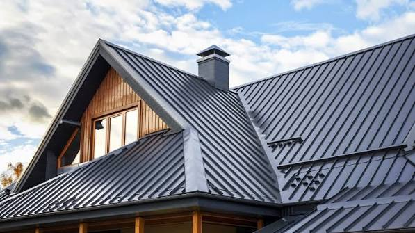 Close view of a dark standing-seam metal roof