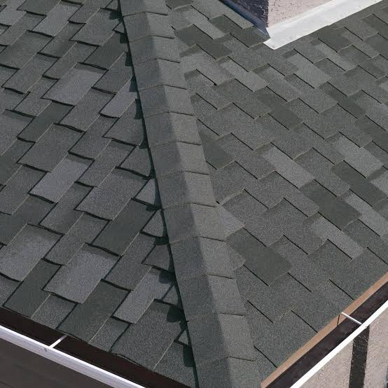 Ridge cap shingles installed along a roof peak