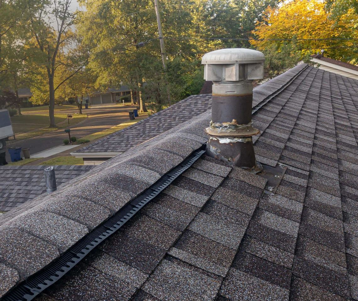 Ridge vent installed along the peak of a shingle roof