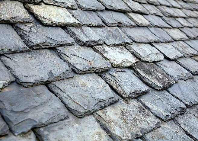 Close view of the layered edges and surface texture of natural slate tiles